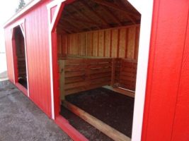 Old Hickory Sheds 12'x28' Animal Shelter Painted Scarlet Red with Metal Roof Door View