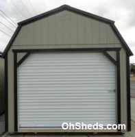 Old Hickory Sheds 12'x24' Lofted Garage Painted Clay with Black Metal Roof Rollup Door View